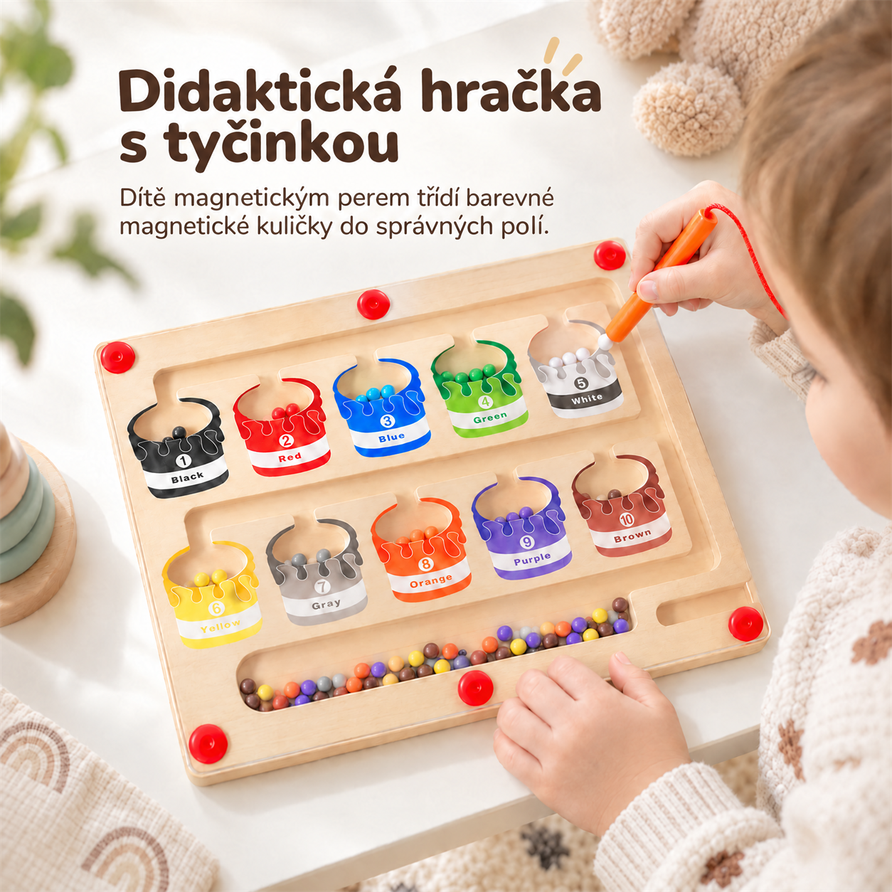 Questo giocattolo didattico è dotato di una bacchetta che il bambino usa per ordinare le palline magnetiche colorate nelle scatole giuste!